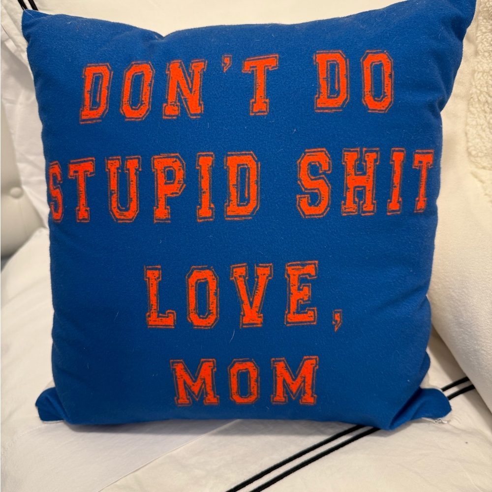 Blue Pillow with Orange Text